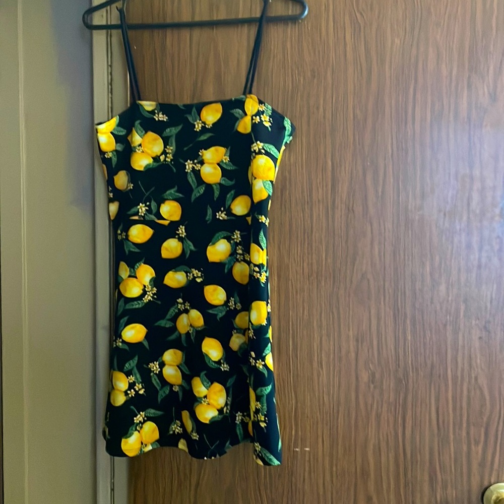 Black background with yellow lemons on it